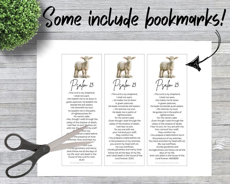 May include: Three rectangular paper bookmarks featuring a graphic of a lamb at the top and the text of Psalm 23 printed below. The bookmarks are arranged side-by-side on a white sheet, with a pair of black scissors positioned over the left bookmark.