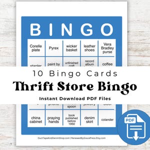 May include: A printable "Thrift Store Bingo" game card set with a blue and white design. The bingo card features a grid with various thrift store-related items like "Corelle plate" and "denim skirt". The text "Thrift Store Bingo" is prominently displayed.
