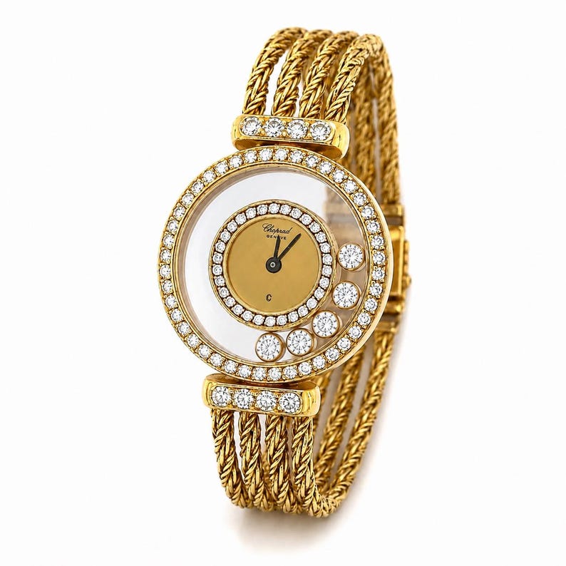 May include: A gold wristwatch featuring a round case with a diamond-encrusted bezel and five floating diamonds inside the crystal. The dial is gold with black hands and the Chopard Geneve logo. The band consists of multiple braided gold rope strands.