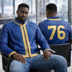 May include: A blue and gold jacket with the number 76 on the back. The jacket has a zip-up front and gold stripes down the sides. The person in the image is wearing blue jeans. The jacket is a cosplay item.