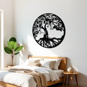 May include: Black metal wall art depicting a tree of life with intricate branches and roots. The tree is set against a white background and is displayed in a bedroom setting.