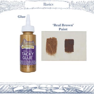 May include: A gold bottle of Aleene's Original Tacky Glue with a white cap, labeled 2 FL OZ (59 mL), positioned next to a rectangular swatch card displaying two distinct brown paint strokes labeled as 'Real Brown' Paint.