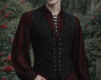 May include: A black vest with an intricate floral pattern over a red shirt with a lace-up neckline. The shirt has long sleeves with ruffled cuffs. The outfit is completed with black pants, creating a gothic or Victorian-inspired look.