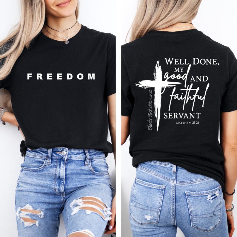 May include: Black t-shirt with the word "FREEDOM" in white block letters. The back of the shirt features a white cross and the text "Well Done, My Good and Faithful Servant" with the reference Matthew 25:21.