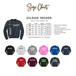 May include: A size chart for a Gildan 18000B youth fine jersey tee, with measurements in inches. The chart includes chest and length measurements for sizes XS to XL. Below the chart are examples of the sweatshirt colors: black, white, sport grey, safety pink, royal, navy, red, maroon, forest green, and dark heather.