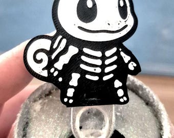 Apribottigliette a forma di simpatico scheletro