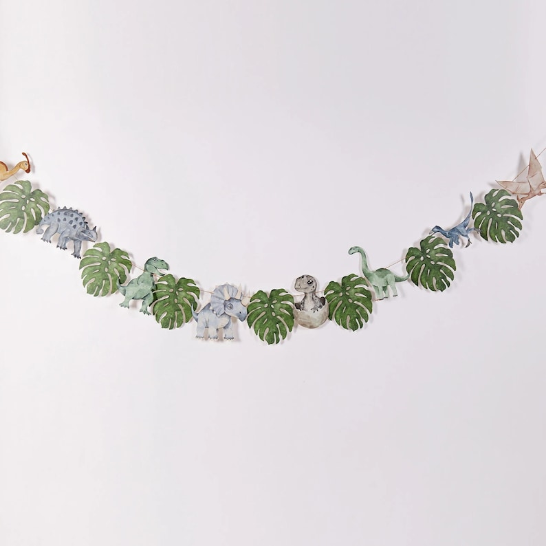 Front-facing view of fully assembled Joy Ladder Dinosaurs banner showing entire length
