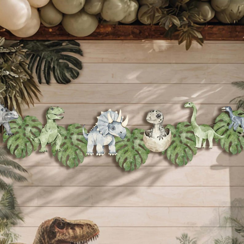 Staged party scene featuring Joy Ladder Dinosaurs banner hung on wall