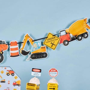 May include: A construction-themed party banner with various vehicle cutouts, including a dump truck, excavator, and cement mixer. The banner also features road signs with text like "Under Construction" and "Danger Kids at Play".