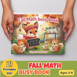 May include: A spiral-bound Fall Math busy book featuring a cartoon fox wearing a yellow hat and red scarf holding a chalkboard with math equations. Three smaller foxes with notebooks are nearby in a forest setting. Text reads Fall Math busy book.