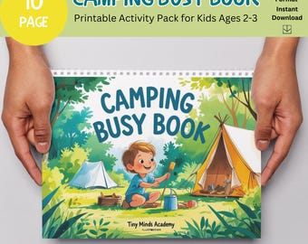 Op de afbeelding: Een spiraalgebonden "Camping Busy Book" voor kinderen van 2-3 jaar, vastgehouden door handen. De omslag toont een cartoon illustratie van een kind dat kampeert, met tenten en bomen. Tekst bevat "Camping Busy Book".