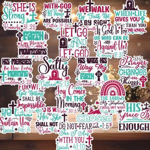 May include: A collection of colorful Christian-themed stickers with various inspirational quotes and Bible verses. The stickers feature crosses, floral designs, and phrases like "She is Strong" and "Let Go and Let God." The stickers are on a wooden surface.
