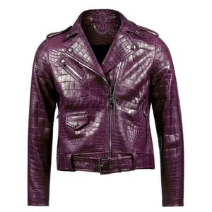 May include: A deep purple leather jacket with a crocodile skin effect. The biker-style jacket has a notched collar, an off-centre zip, and a belt at the waist. It includes multiple pockets and silver-coloured metal hardware.