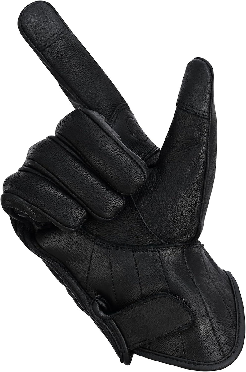 May include: Black leather motorcycle gloves with a textured finish. The gloves have reinforced knuckle padding and a Velcro strap closure. The index finger and thumb are designed for touchscreen use.