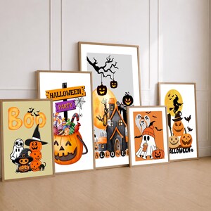 May include: Five framed rectangular wall art prints featuring Halloween themes. The illustrations include a stack of pumpkins and ghosts, a pumpkin bucket filled with candy, a haunted house, a ghost with a drink, and a witch flying past a moon.