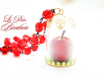 Snow white poison apple in a glass capsule necklace