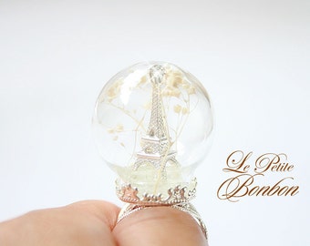 Eiffel Tower in a glass globe winter wonderland edition ring