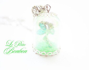 Tinkerbell with pixie dust in a glass capsule necklace