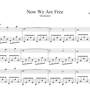 以下が含まれることがあります： 映画「グラディエーター」の楽曲「Now We Are Free」の楽譜。作曲はハンス・ジマー。白地に黒インクで書かれた楽譜で、音符と五線譜が描かれています。