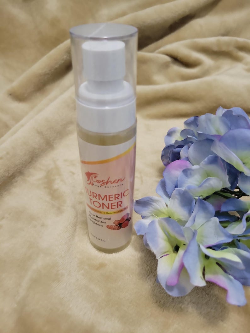 May include: A clear plastic bottle with a white pump dispenser containing a yellow liquid. The bottle is labeled "Koshen Naturals Turmeric Toner" and lists benefits such as "Acne Removal, Moisturizes, Brightens".