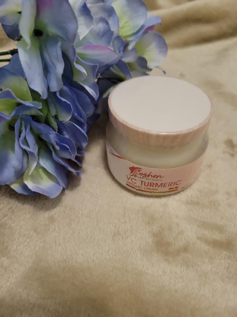May include: A white jar with a pink lid and label. The label says "Koshen Naturals" and "VC Turmeric Organic Cream".