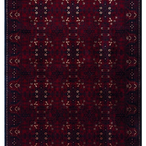 May include: A rectangular, patterned rug with a deep red and navy blue color scheme. The rug features a repeating geometric design with accents of gold. The edges are finished with a navy border and white fringe.