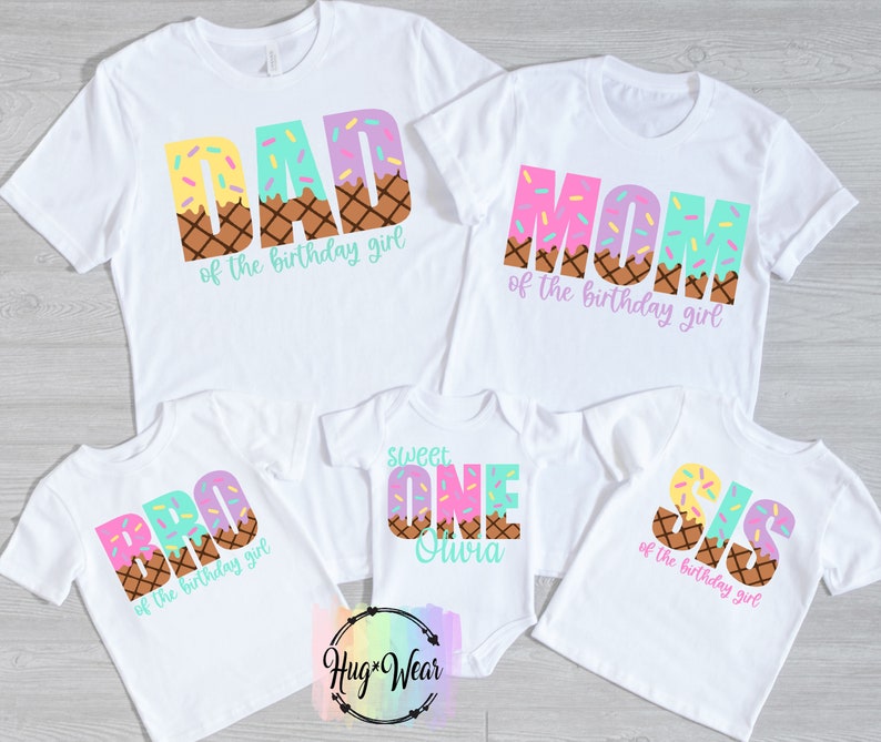 May include: Five white t-shirts with ice cream cone designs and text. The shirts say "Dad of the birthday girl", "Mom of the birthday girl", "Bro of the birthday girl", "Sweet One Suvra", and "Sis of the birthday girl".
