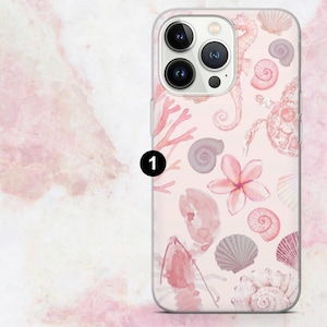 May include: Clear phone case featuring a pink and white watercolor design of seashells, coral, seahorses, and a turtle. The case has a glossy finish and a raised edge to protect the phone's screen and camera.