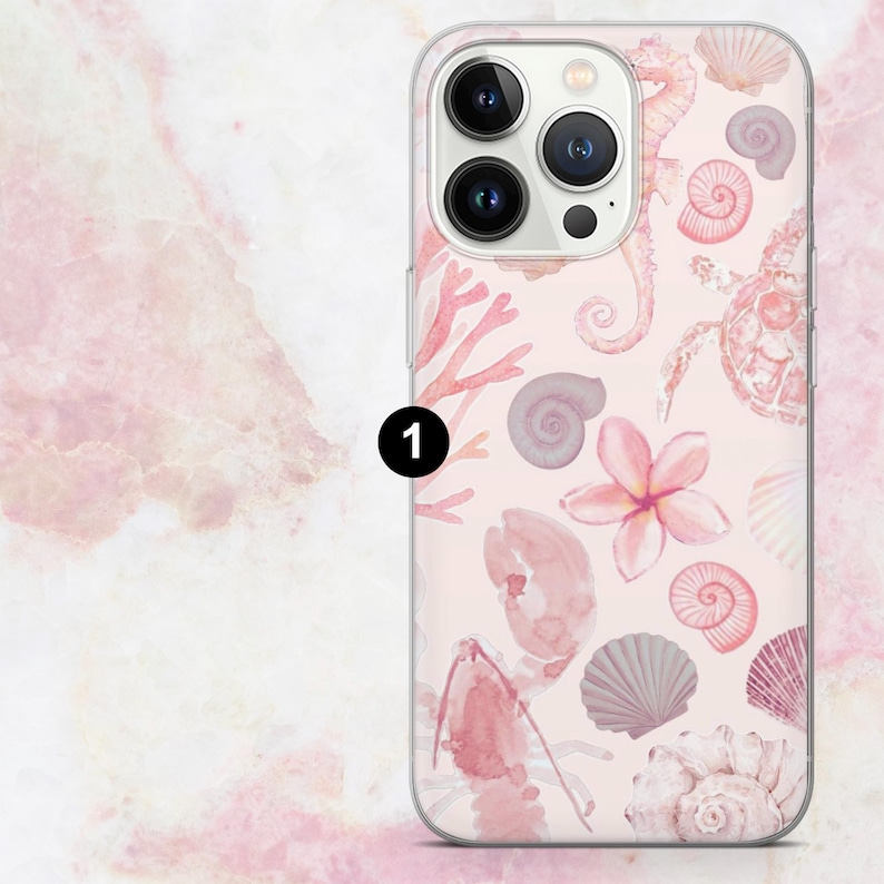 May include: Clear phone case featuring a pink and white watercolor design of seashells, coral, seahorses, and a turtle. The case has a glossy finish and a raised edge to protect the phone's screen and camera.