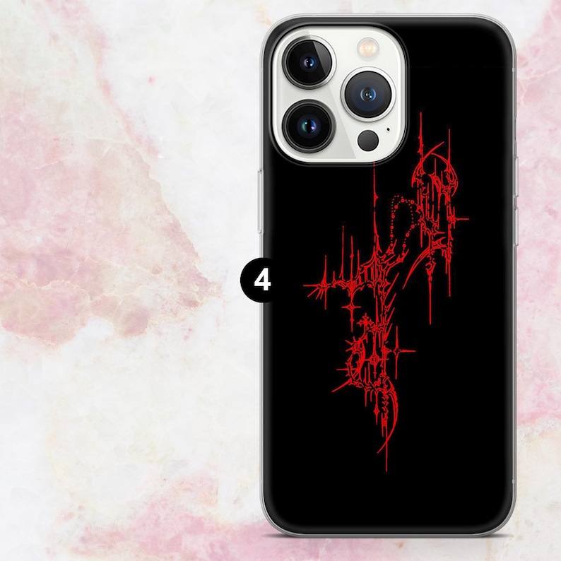 May include: Black phone case with a red abstract design. The case has a clear border and features a complex, spiky pattern in red against a black background. The number "4" is visible on the side of the case.