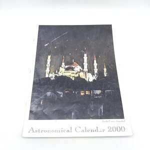 May include: Astronomical Calendar 2000 featuring a nighttime painting of a mosque with tall minarets and a central dome. The image is set against a dark sky with the text "fireball over Istanbul".