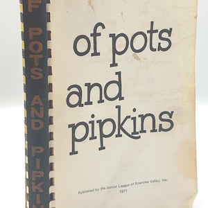 May include: A vintage spiral-bound cookbook titled of pots and pipkins, published in 1971 by the Junior League of Roanoke Valley, Inc. The cover is off-white with dark brown text, featuring a black spine with the title printed in brown.