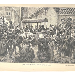 May include: An antique black and white print depicting a historical scene titled "The Entrance of Luther into Worms." The image shows a crowd of people in period clothing, with a carriage in the center. The print is on aged paper.