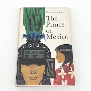 May include: A vintage book titled "The Prince of Mexico" by Federica de Cesco. The cover features a stylized illustration of a man in a helmet and a woman in profile, with a vibrant green and blue design at the top.