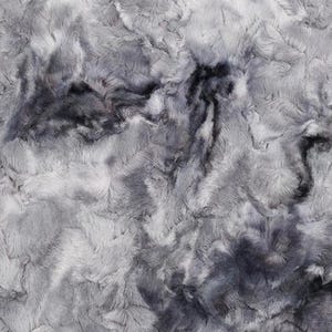 May include: A close-up of a plush fabric with a marbled appearance. The fabric features a blend of gray and charcoal hues, creating a soft, textured surface. The design resembles a flowing, abstract pattern.