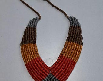 Macrame statement necklace with adjustable length.