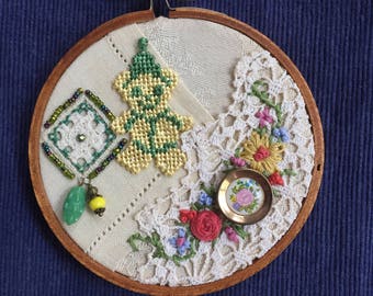 Embroidered Collage Hoop with vintage textiles, charms, beads, trim, upcycled art