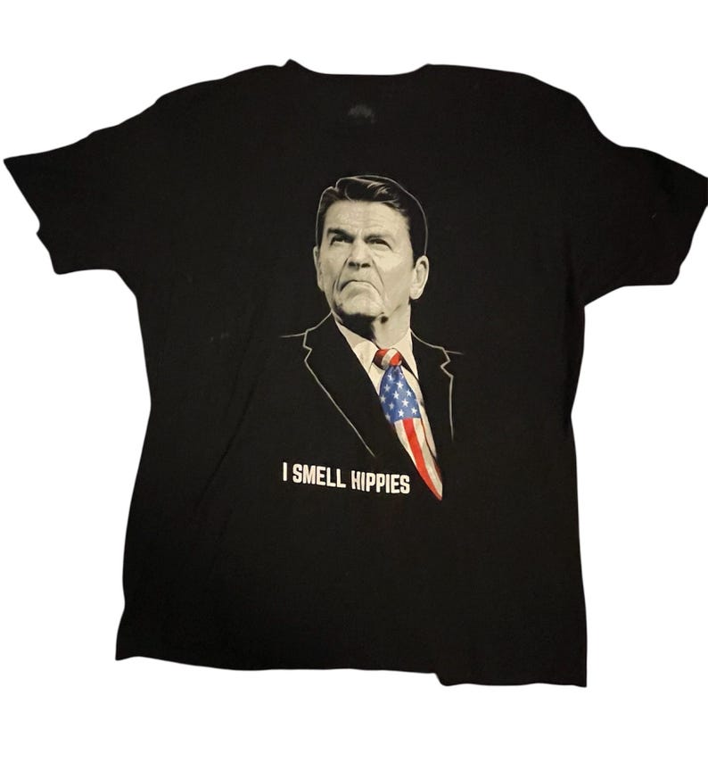Camiseta negra estampada para hombre con el lema "Huelo a hippies" de Ronald Reagan, talla XL. imagen 1