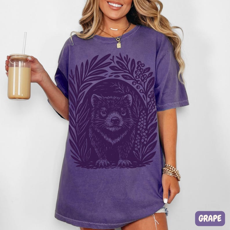 Hand-carved linocut Tasmanian Devil illustration with stylized foliage, minimalist wildlife art printed on cotton t-shirt on purple color