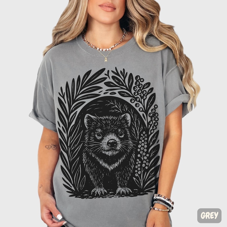 Hand-carved linocut Tasmanian Devil illustration with stylized foliage, minimalist wildlife art printed on cotton t-shirt