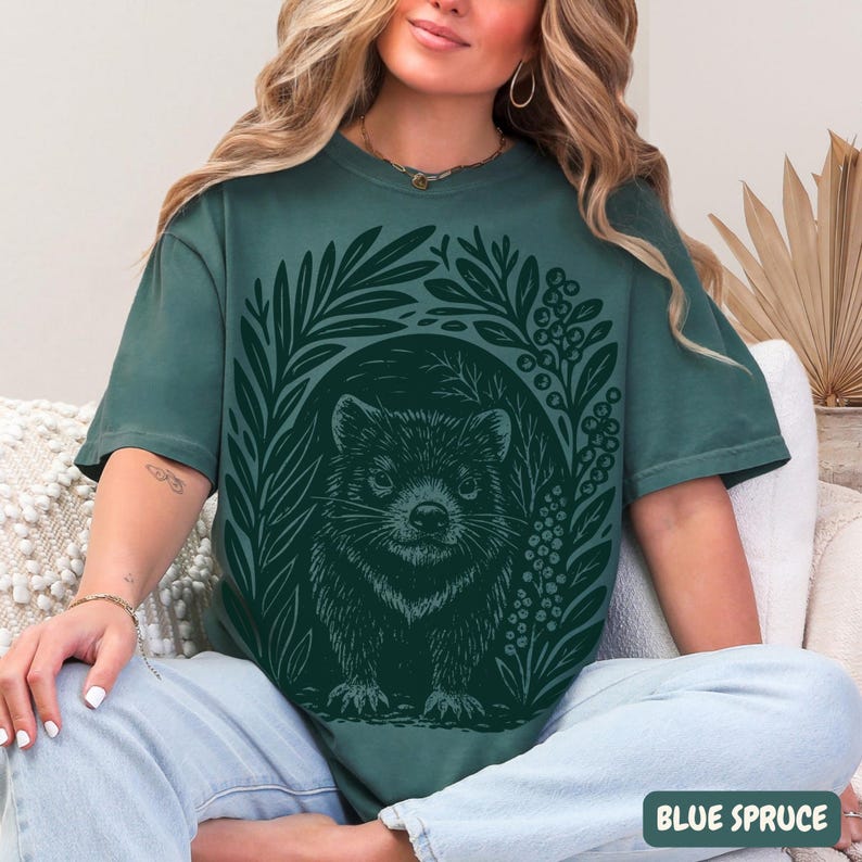 Tasmanian Devil graphic t-shirt in linocut block print style, rustic wildlife illustration on Comfort Colors garment-dyed tee on Blue Spruce color