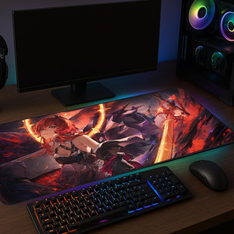 May include: A large, rectangular gaming mousepad featuring a vibrant anime-style illustration with a red-haired character. The pad has a black keyboard, mouse, and a computer monitor on a wooden desk. The pad has a colorful LED edge.