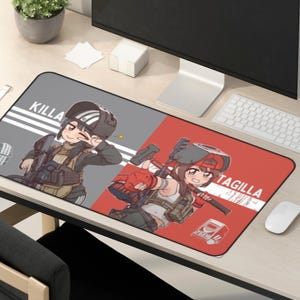 May include: A rectangular mousepad featuring two anime-style characters. One side is gray with the word "KILLA" and a character in tactical gear. The other side is red with "TAGILLA" and a character with a hammer.