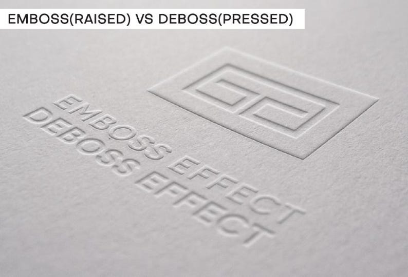 May include: A light gray textured paper surface featuring the text EMBOSS(RAISED) VS DEBOSS(PRESSED) at the top. Below, a rectangular logo outline is embossed, while the words EMBOSS EFFECT and DEBOSS EFFECT are debossed into the paper material.