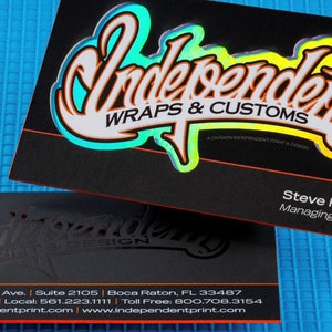 May include: Black business card with a silver and iridescent logo that says "Independent Wraps & Customs". The text "A Division of Independent Print & Design" is also on the card. The card also has the name "Steve Rhodes" and the title "Managing Partner".