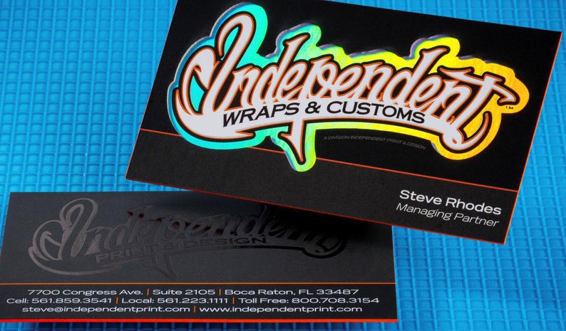 May include: Black business card with a silver and iridescent logo that says "Independent Wraps & Customs". The text "A Division of Independent Print & Design" is also on the card. The card also has the name "Steve Rhodes" and the title "Managing Partner".