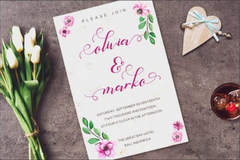 May include: A rectangular wedding invitation card featuring pink watercolor flowers and green leaves. The text reads: PLEASE JOIN, Olivia & marko, SATURDAY, SEPTEMBER SEVENTEENTH, TWO THOUSAND AND EIGHTEEN, AT FOUR O'CLOCK IN THE AFTERNOON, THE GREAT BAY HOTEL, BALI, INDONESIA.