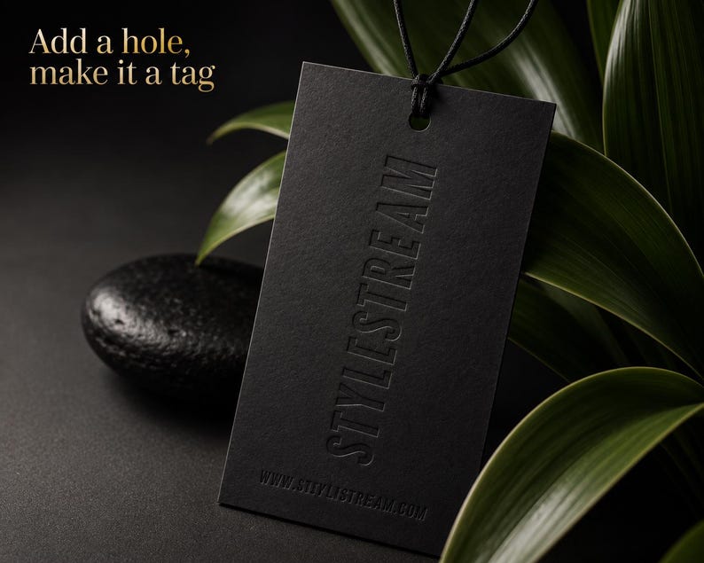 May include: A rectangular black tag with a hole at the top and a black string loop. The tag features the embossed text STYLISTREAM vertically and the website URL WWW.STYLISTREAM.COM at the bottom. The text Add a hole, make it a tag is visible.