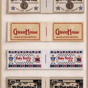 May include: Four rectangular fabric clothing labels featuring embroidered designs. The top label reads John Baner Authentic Jeans Wear For Your Comfort. The second reads GreenHouse House of possibilities. The third reads Baby Beetle U.K. The bottom reads PEPPERMINT.