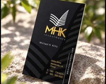 May include: A vertical black business card featuring a gold MHK Investments logo, the name Michael H. Kritz, and contact details including Delta Drive, Mandeville, LA 70448, phone 985 778-6270, fax 985 893-0087, and the website mhkinvestments.com.